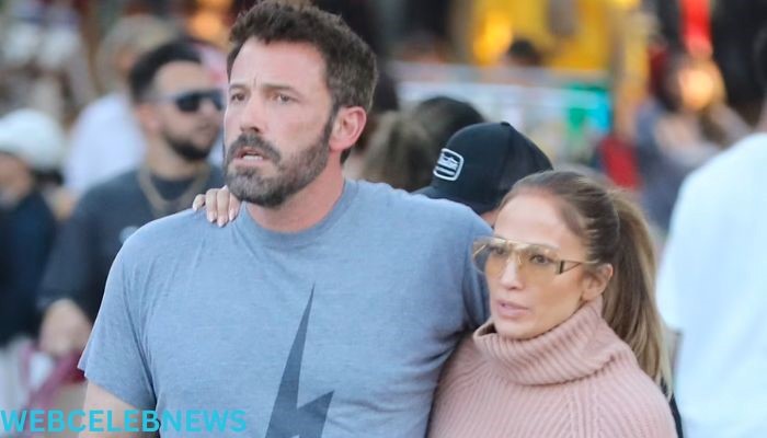 Jennifer Lopez and her spouse Ben Affleck browse the Hollywood flea market while she stays warm in jeans and a turtleneck sweater.